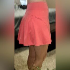 Werena coral high waisted tennis skort with a flirty back.